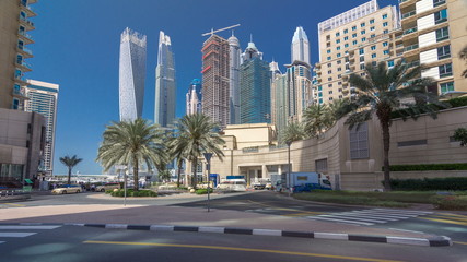 Fototapeta na wymiar Panoramic view with modern skyscrapers and yachts of Dubai Marina timelapse hyperlapse, United Arab Emirates