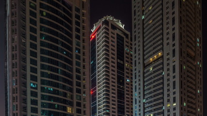 Scenic glowing windows of skyscrapers at night timelapse