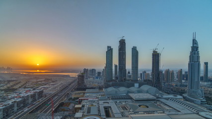 Dubai downtown with sunrise timelapse. Top view from above