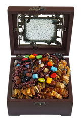A young woman keeps her beads  necklaces and bracelets in a box of mahogany