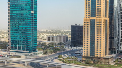 Fototapeta na wymiar Aerial view of Jumeirah lakes towers skyscrapers timelapse with traffic on sheikh zayed road.