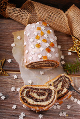 christmas poppy cake on wooden table