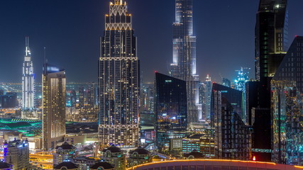 Dubai downtown skyline night timelapse with tallest building and Sheikh Zayed road traffic, UAE