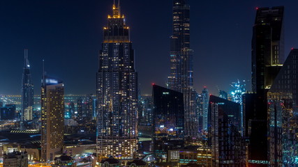 Fototapeta na wymiar Dubai downtown skyline night timelapse with tallest building and Sheikh Zayed road traffic, UAE