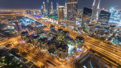Fototapeta na wymiar Dubai downtown skyline night timelapse with mall and road traffic, UAE