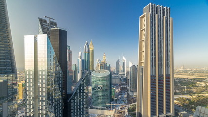 Fototapeta premium Skyline view of the buildings of Sheikh Zayed Road and DIFC timelapse in Dubai, UAE.