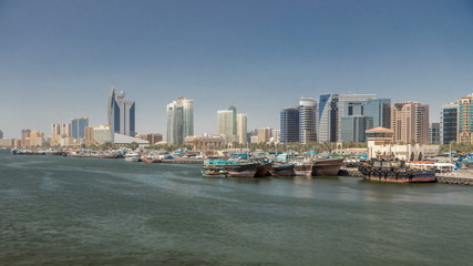 Obraz premium Trading wooden boats in the port timelapse. Merchant ships on the Creek Canal.
