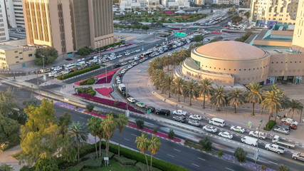Dubai Creek area surrounded by modern buildings and busy traffic street timelapse