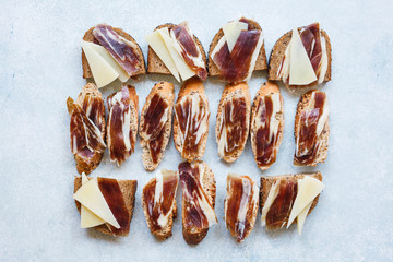 Tapas sandwich cheese jamon Iberico spanish ham cured pork meat