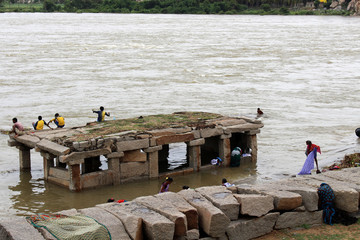 People around the white ashram across the main island of Hampi (Anegundi)