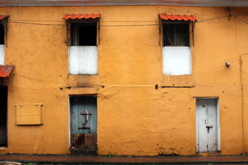 Translation: the yellow vintage and colorful windows and doors in Goa City.