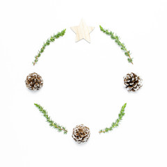 Christmas composition. Wreath of fir branches, cones, wooden toys on white background Flat lay top view copy space square. Christmas winter decoration, Nature New Year concept minimalist style