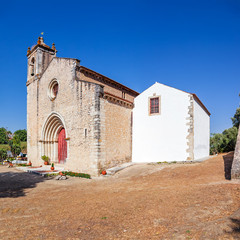 Santarem, Portugal. Facade with gothic portal and bell tower or belfry of the Igreja de Santa Cruz...
