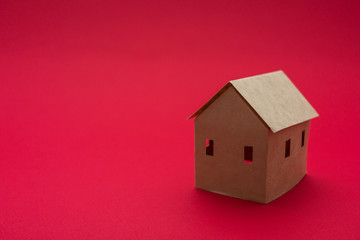 Paper Home, red background with copy space, for advertising, close up
