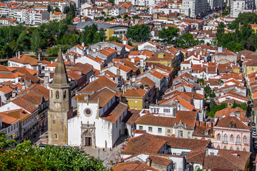 Fototapeta na wymiar Tomar, Portugal. The city of Tomar with Igreja de Sao Joao Baptista Church and Republica Square. Seen from the Castle of Tomar and Convento de Cristo