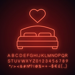 Lovers bed neon light icon