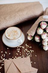 Cappuccino with nuts on the table.