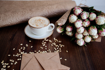 Cappuccino with nuts on the table.