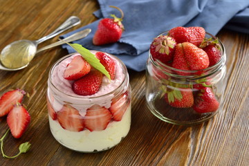 Cottage cheese with strawberries in a jar. Healthy nutrition.