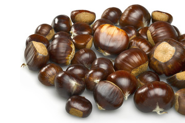 Lot of organic chestnuts isolated on white