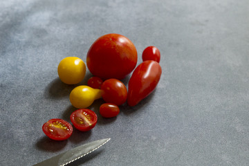 A row of red and yellow tomatoes