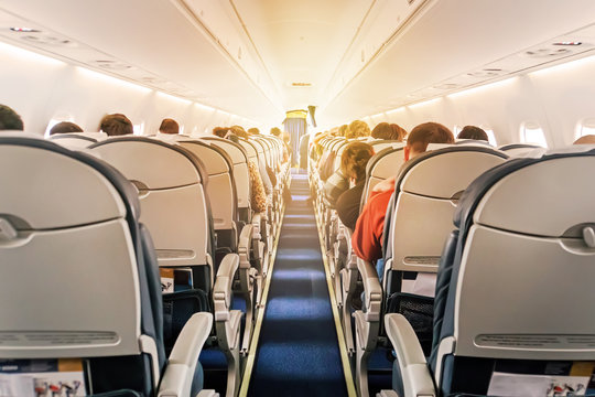 Commercial Aircraft Cabin With Rows Of Seats Down The Aisle