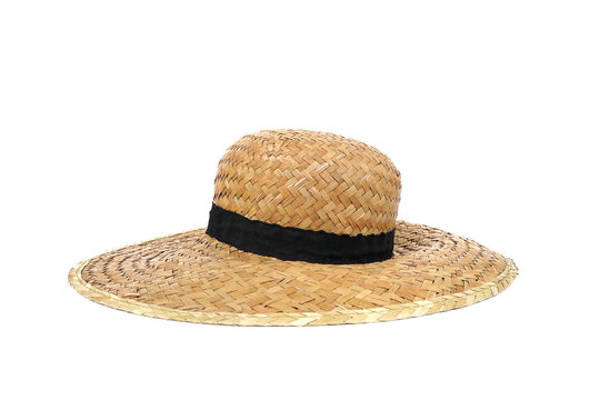 Summer beige straw hat isolated on white background.Close up of handcraft weave wide brim hat made from reed,bamboo,rattan.Decoration with ribbon band on plain design.Fashion,Holiday,Decor Concept.