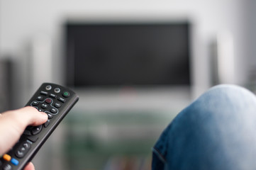 Hand with TV remote control