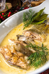 fried christmas carp in butter sauce with dill and lemon