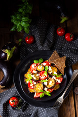 Eggplant grilled with aromatic feta cheese and tomatoes
