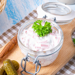 delicious homemade meat salad with mayonnaise and cucumber