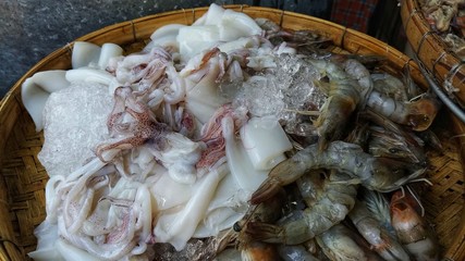 Raw squid with shrimp in the basket
