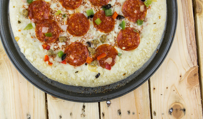 Delicious pepperoni pizza on wooden table.