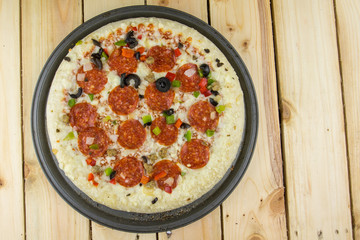 Delicious pepperoni pizza on wooden table.
