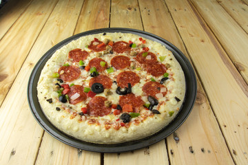 Delicious pepperoni pizza on wooden table.