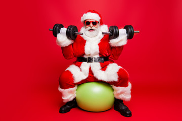 Cheerful sporty muscular virile strong Santa in white fluffy glo © deagreez