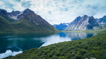 Naklejka na ściany i meble Aerial view of beautiful lake in high altitude mountains