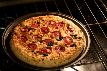 Delicious pepperoni pizza in the oven