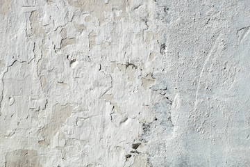 Old cracked plaster wall. White textured background