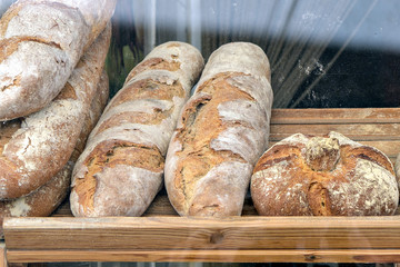 Closeup of artisan bread displayed in French bakery.