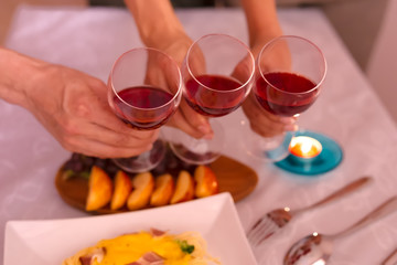 close up hand of celebration the team's success couple or friendship which happy moment relaxing ,red,wineglass,celebration on the in the office