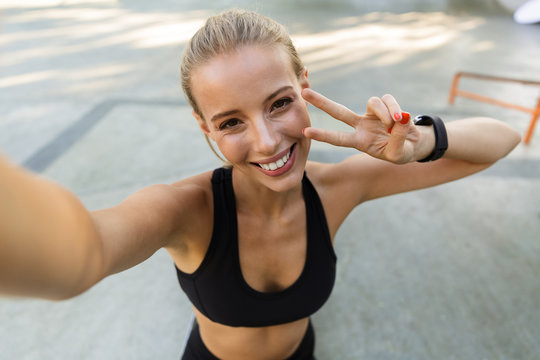 Fitness Woman In Park Make Selfie By Camera.