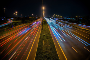 Fototapeta na wymiar Speed Traffic - light trails on motorway highway at night, long exposure