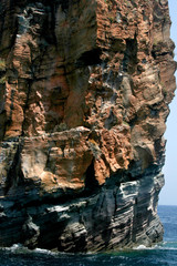 Colorful rocky formation and surf on the Lipary island, Sicilia, Italy.
