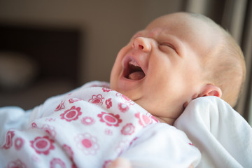 Crying newborn baby try to sleep © poplasen