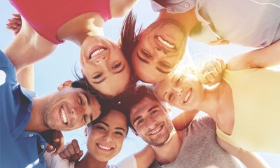 Fotobehang Group of happy young people in circle © BillionPhotos.com