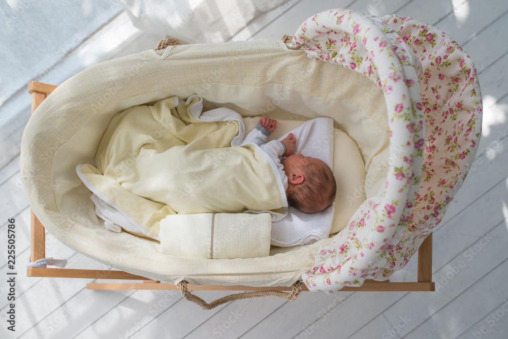 Wall mural top view vintage crib and sleeping baby