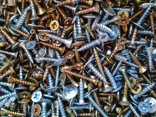 Ironmongery silver bronze iron stainless steel tapping screw background texture macro photo
