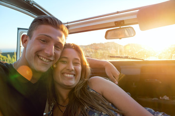Happy couple in a car