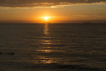 beautiful bright sunset on the shore of the Baltic Sea among the clouds